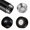 Black thermos with digital temperature display, metal mesh filter, and black lid components on a white background.